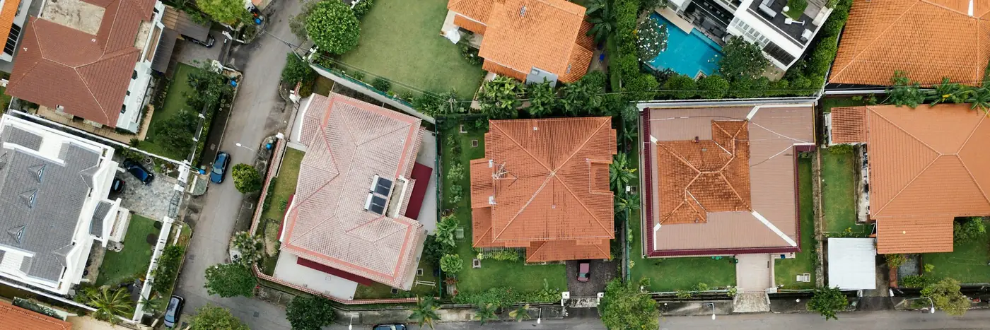 Aerial view of Mediterranean holiday villas with terracotta roofs and pools